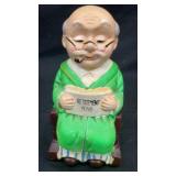 Ceramic grandpa in rocking chair coin bank