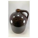 Dark brown pottery jug (no markings)
