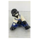 Black Americana figurine taking a rest 3' x 2'