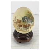 Small ceramic egg w/ puppies playing (w/ stand)