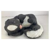 Ceramic skunk laying down 5' x 4' x 2.5'