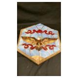 Concrete stone decor featuring stained glass eagle