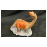 Hard plastic dinosaur coin bank