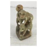 Climbing monkeys carved out of soapstone