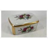 Ceramic trinket box w/ floral motif 2.5' x 1.5'
