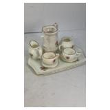 Tiny miniature porcelain (8) piece tea set