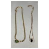 (2) Avon Necklaces; a green butterfly & black oval