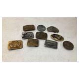 Flat of John Deere belt buckles