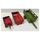 (3) metal toy tractor trailers
