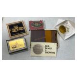 Flat of John Deere ornaments, coaster, brass coin