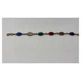 STONE CARVED SILVER RIMMED BRACELET