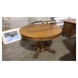 OAK CLAW FOOTED ROUNG DINING TABLE ON WHEELS