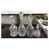 4 GLASS DECANTERS WITH STOPPERS