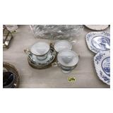 4 PORCELAIN TEA CUPS & SAUCERS