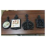 4 CAST IRON TRIVETS
