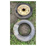 2 FARMALL CUB FRONT TIRES, 1 WITH RIM