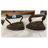 (2) CAST IRON SAD IRON DOOR STOPS
