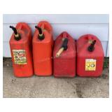 Four 5 gallon gas cans