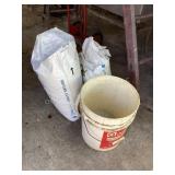 Bags of Fertilizer & Some in Bucket