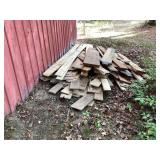 Pile of mixed size rough sawn lumber