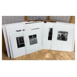 18 black and white photos on thick board