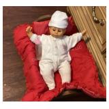 Baby doll in wood cradle (18"l x 10"w x 8"t)
