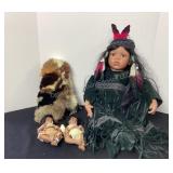 4 porcelain Native American dolls