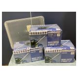 3 unopened boxes of wood coffee stirrers & bin