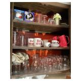 Cupboard of mugs, glasses, carafe, Captain