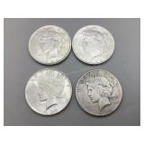 Four 1922 Peace Silver Dollars
