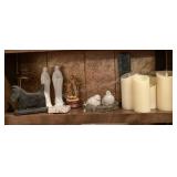 Shelf of Battery operated candles, bird