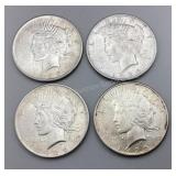 Four 1925 Peace Silver Dollars