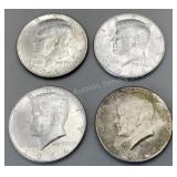 Four 1964 Kennedy half dollars