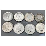 Eight 1964 Kennedy half dollars