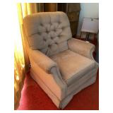 Beige swivel rocking chair