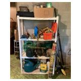 Plastic shelving unit of gardening supplies,