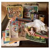 Old lunch boxes, comics, tin juice cans, dolls &