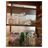 Cupboard of serving dishes & glasses