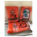 3 orange life vests