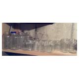 Shelf of canning jars, various sizes