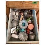 Drawer of kitchen usefuls; molds, measuring