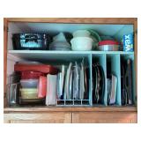 Cupboard of baking pans, storage containers & more