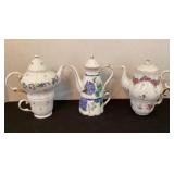 3 miniature teapots with cups