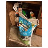 Cupboard of fertilizer & lawn supplies