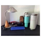 Keurig mini brewer, thermos, Kodak camera, lamp,