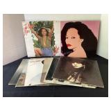 10 records; Diana Ross, Barbara Streisand