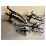 Four 3 jaw pullers