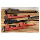 Pipe wrenches & wire brushes