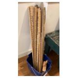 Collection of yard sticks, bucket & brush