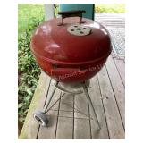 Red Weber charcoal grill, 18x34' tall